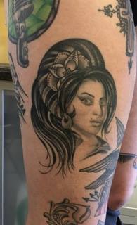 Pictured above is a tattoo of Amy Winhouse by Corey Goyette that Coogan got on her leg after Winehouse died.